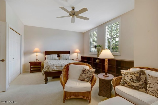 bedroom featuring a ceiling fan and light carpet