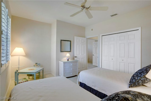 bedroom featuring carpet, a closet, visible vents, a ceiling fan, and baseboards