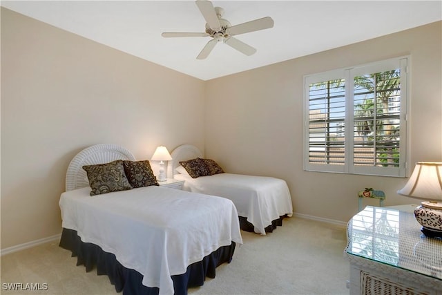 bedroom featuring carpet floors, ceiling fan, and baseboards