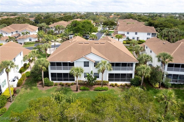 birds eye view of property with a residential view