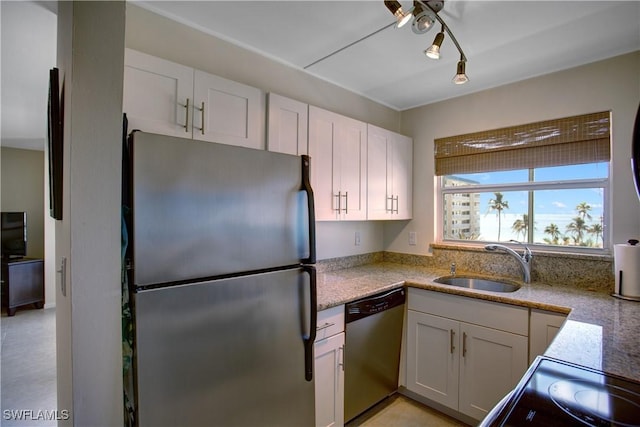 kitchen with white cabinetry, sink, and stainless steel appliances