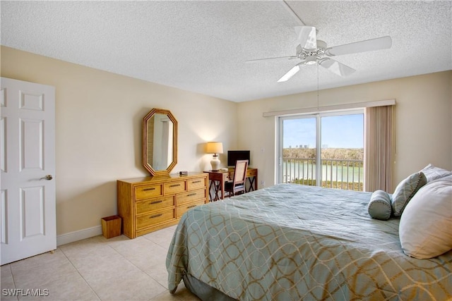 tiled bedroom featuring ceiling fan, a textured ceiling, and access to outside