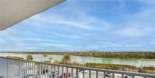 balcony featuring a water view