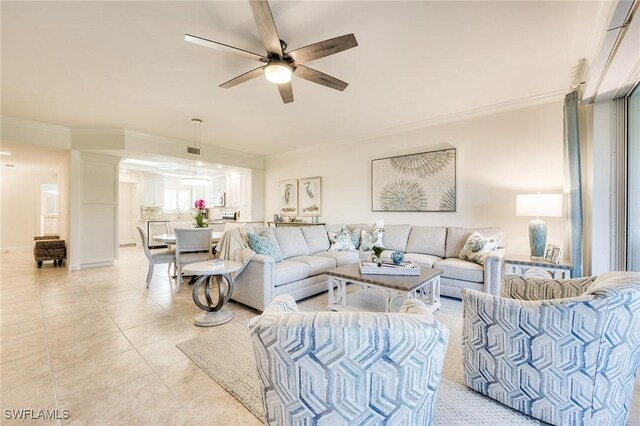 tiled living room with crown molding and ceiling fan