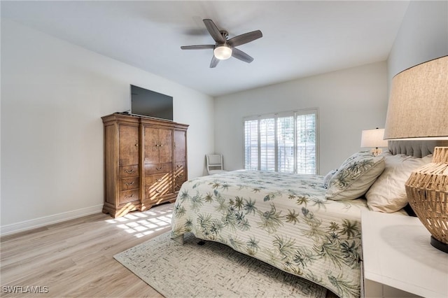 bedroom featuring ceiling fan and light hardwood / wood-style floors