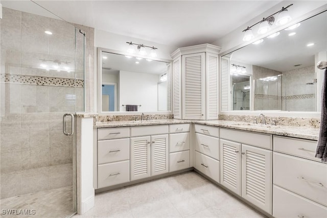 bathroom with vanity and walk in shower