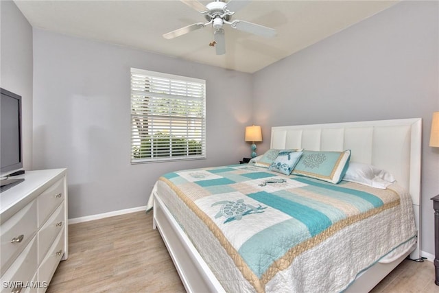 bedroom with ceiling fan and light hardwood / wood-style floors