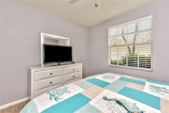 bedroom featuring ceiling fan and hardwood / wood-style floors