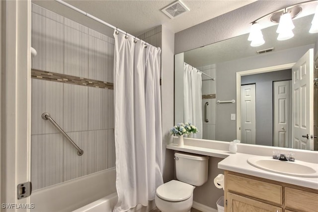 full bathroom featuring vanity, shower / bath combo with shower curtain, and toilet