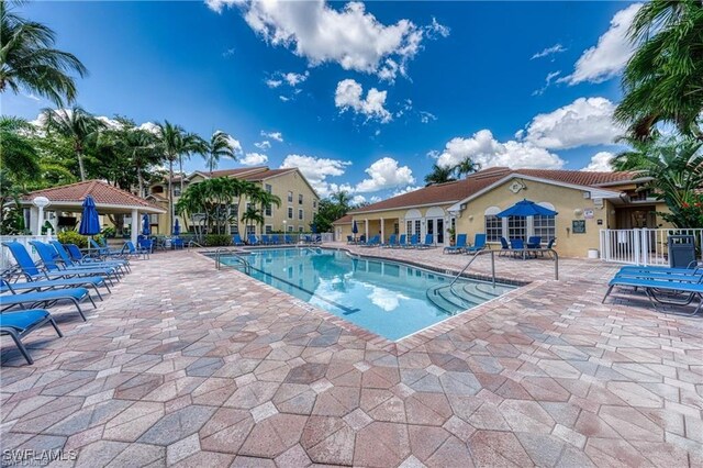 view of swimming pool featuring a gazebo and a patio area