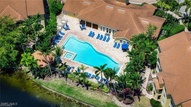 birds eye view of property with a water view