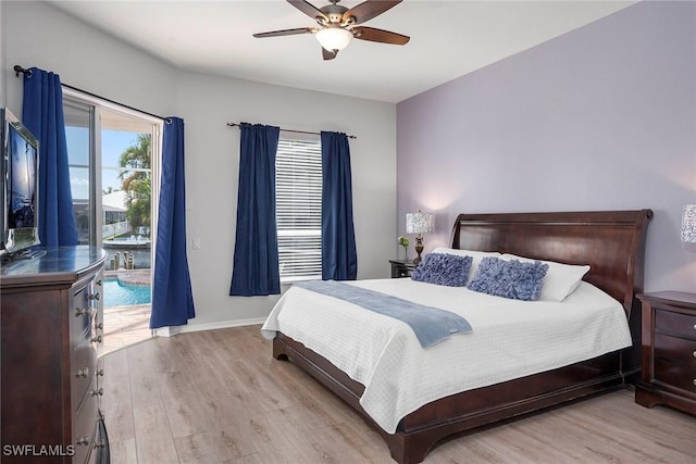 bedroom featuring light hardwood / wood-style flooring, access to outside, and ceiling fan