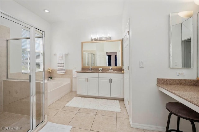 bathroom featuring vanity, tile patterned floors, and separate shower and tub