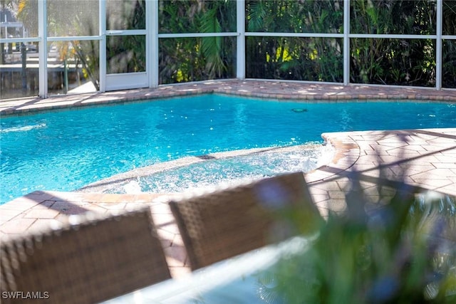 view of pool with a lanai