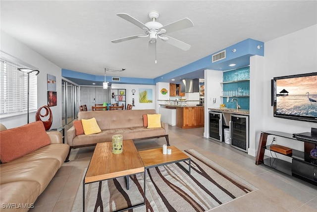 living room with indoor wet bar, wine cooler, and ceiling fan