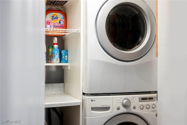 laundry area featuring stacked washer and clothes dryer