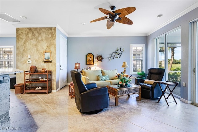 tiled living room with ornamental molding and ceiling fan