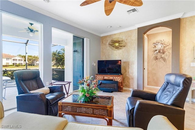 tiled living room featuring ornamental molding and ceiling fan