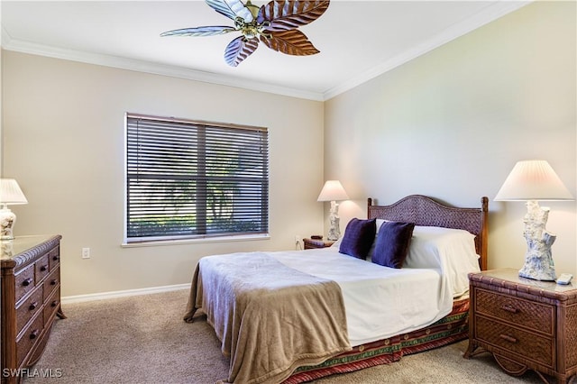 carpeted bedroom featuring ornamental molding and ceiling fan