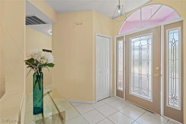 foyer featuring light tile patterned floors