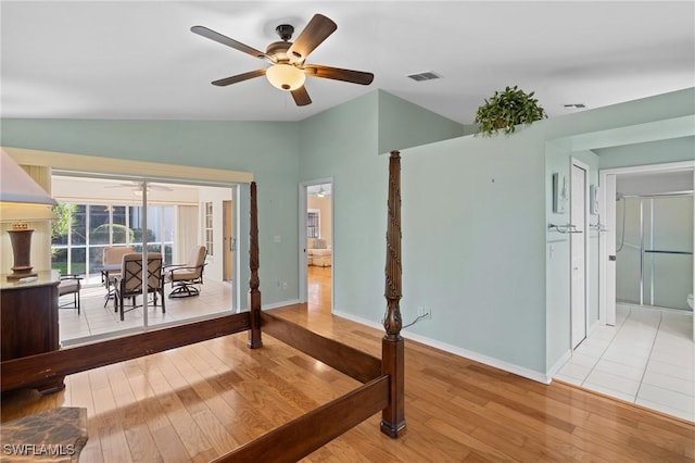 interior space with hardwood / wood-style floors, vaulted ceiling, and ceiling fan