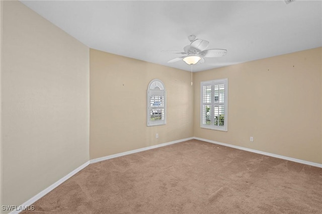 carpeted empty room with ceiling fan