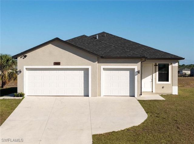 single story home featuring a garage and a front yard