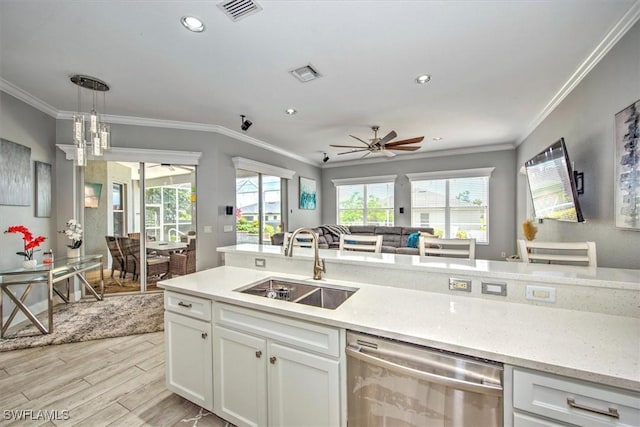 kitchen featuring white cabinetry, dishwasher, sink, and pendant lighting