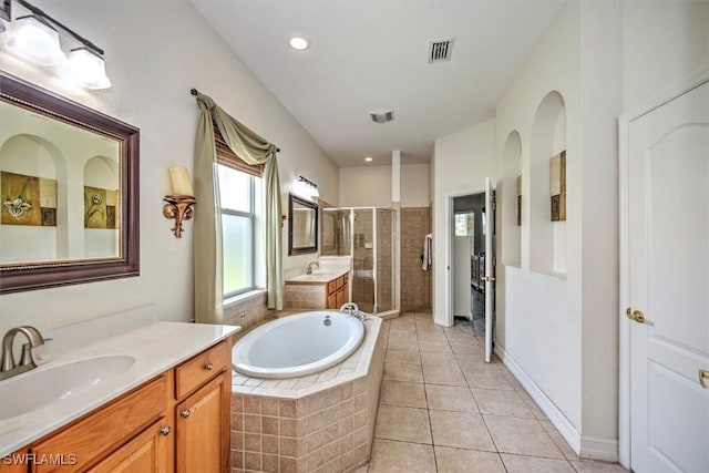 bathroom with independent shower and bath, vanity, and tile patterned floors