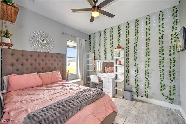 bedroom with ceiling fan and light wood-type flooring