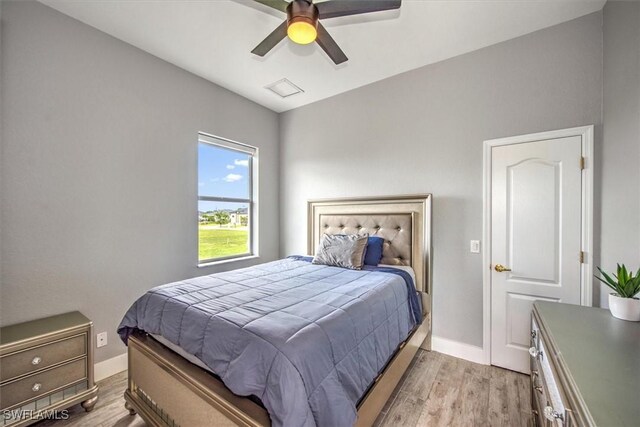 bedroom with ceiling fan and light wood-type flooring