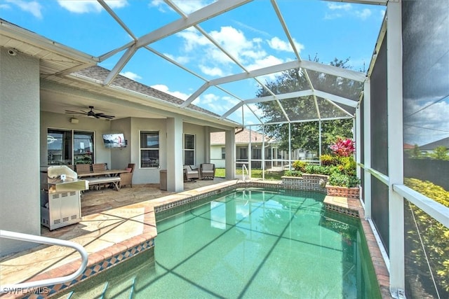 view of swimming pool featuring a lanai and a patio area