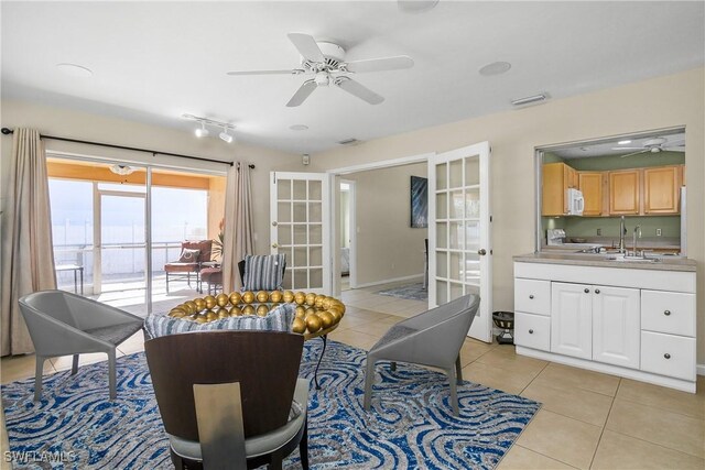 interior space with sink, french doors, and ceiling fan