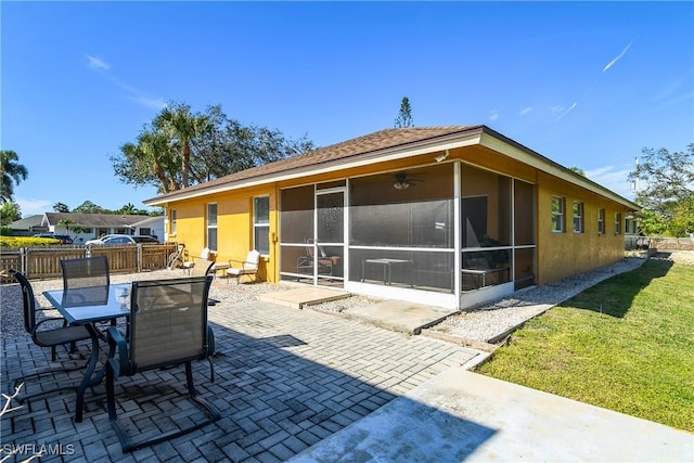 back of house featuring a patio area, a sunroom, and ceiling fan