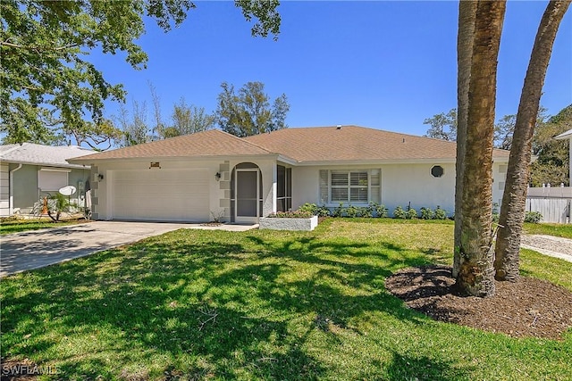 ranch-style house featuring fence, a front yard, stucco siding, concrete driveway, and an attached garage
