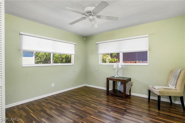 unfurnished room featuring baseboards, a ceiling fan, and wood finished floors