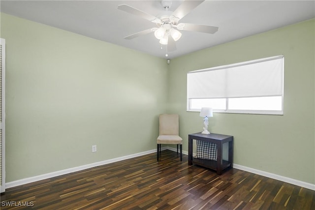 unfurnished room with baseboards, a ceiling fan, and wood finished floors