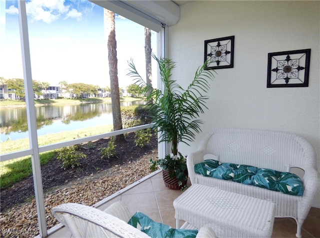 sunroom / solarium with a water view