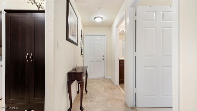 hallway featuring light tile patterned floors