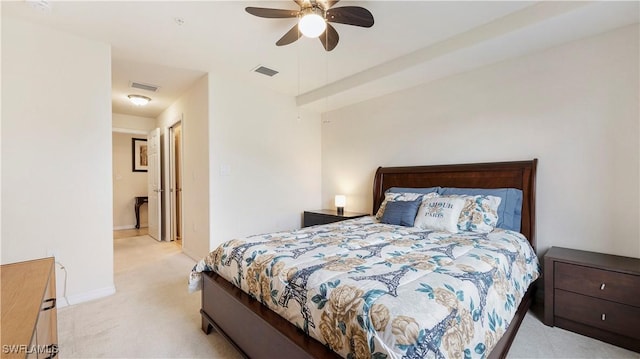 bedroom with light colored carpet, visible vents, ceiling fan, and baseboards