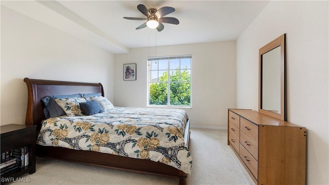 bedroom with ceiling fan, baseboards, and light colored carpet