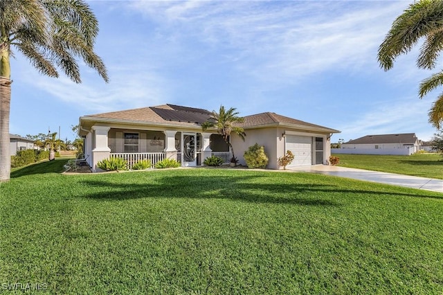 view of front of property featuring a porch, a garage, a front lawn, and solar panels