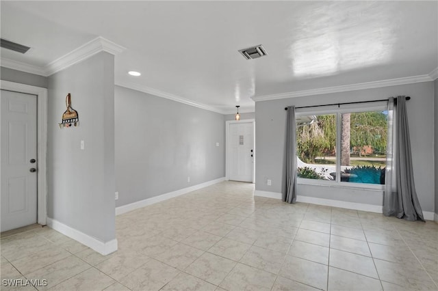 tiled spare room with crown molding