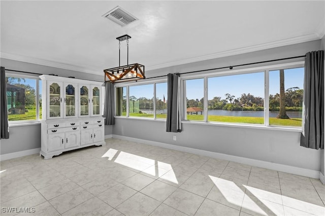 unfurnished sunroom featuring a water view