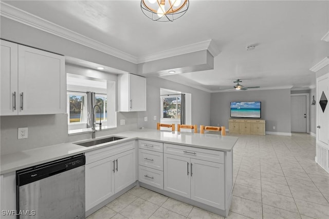 kitchen with dishwasher, sink, white cabinets, and kitchen peninsula