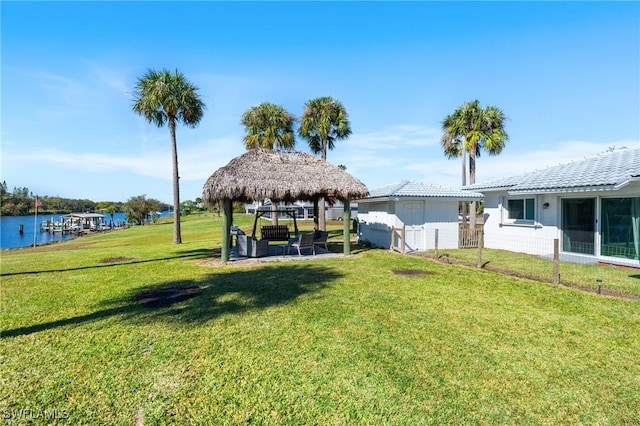 view of yard featuring a gazebo and a water view