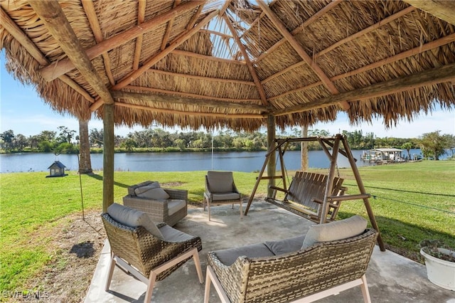 view of patio / terrace with a gazebo and a water view