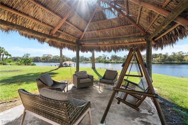 view of patio with a gazebo and a water view