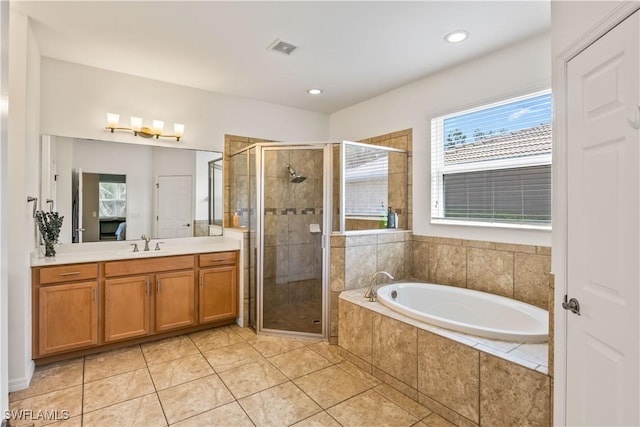 bathroom featuring vanity, tile patterned floors, and shower with separate bathtub