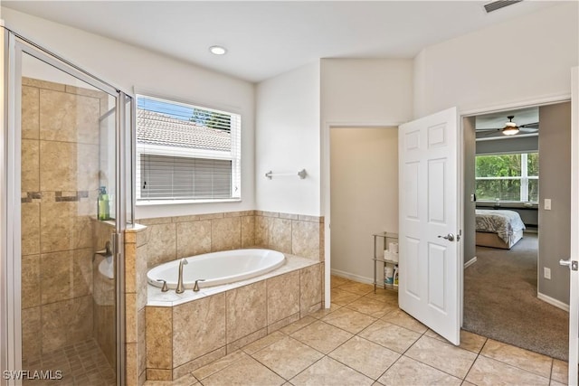 bathroom featuring independent shower and bath and tile patterned flooring